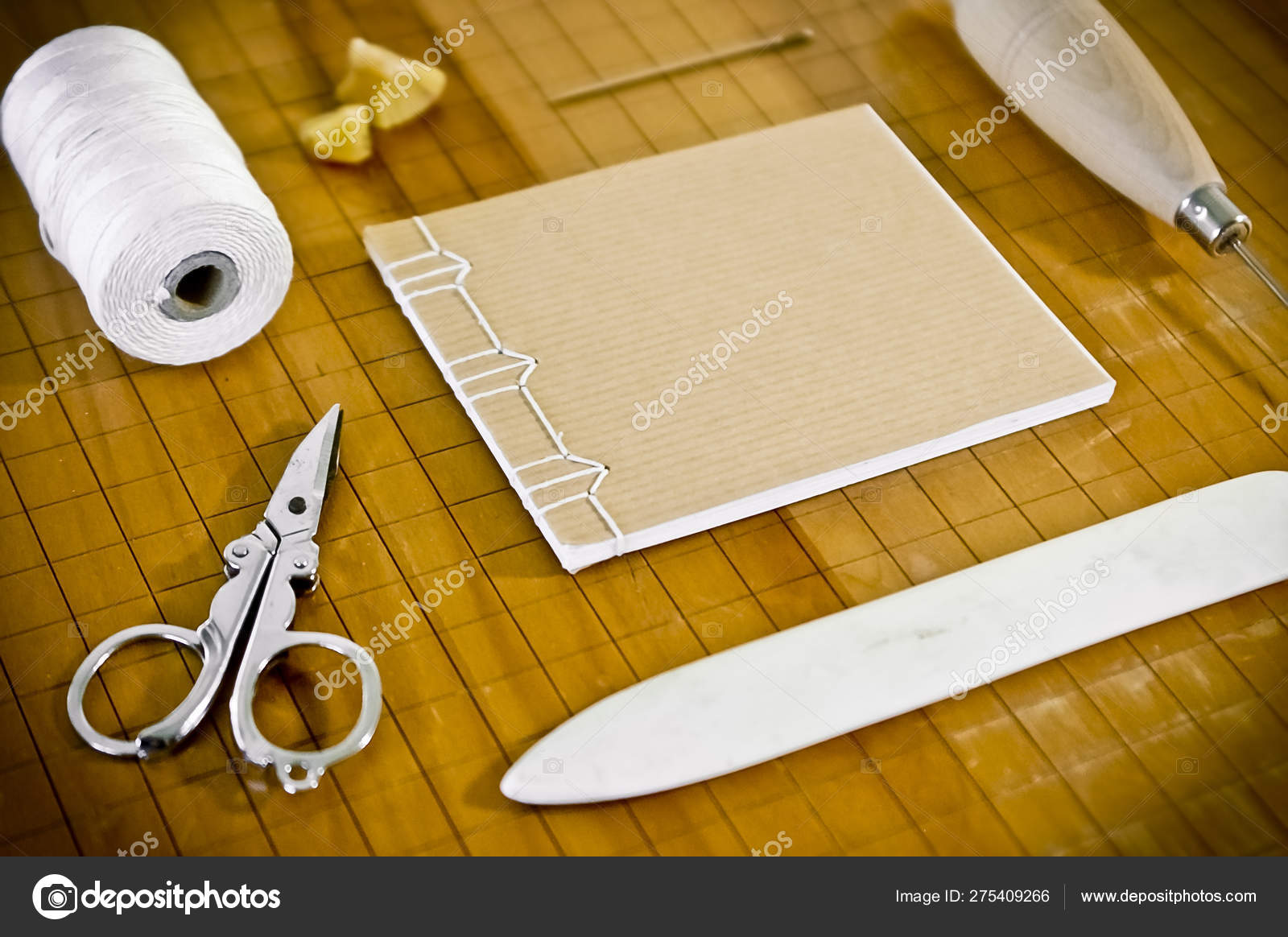 Small Hand Sewn Notebook Bookbinding Supplies Stock Photo by